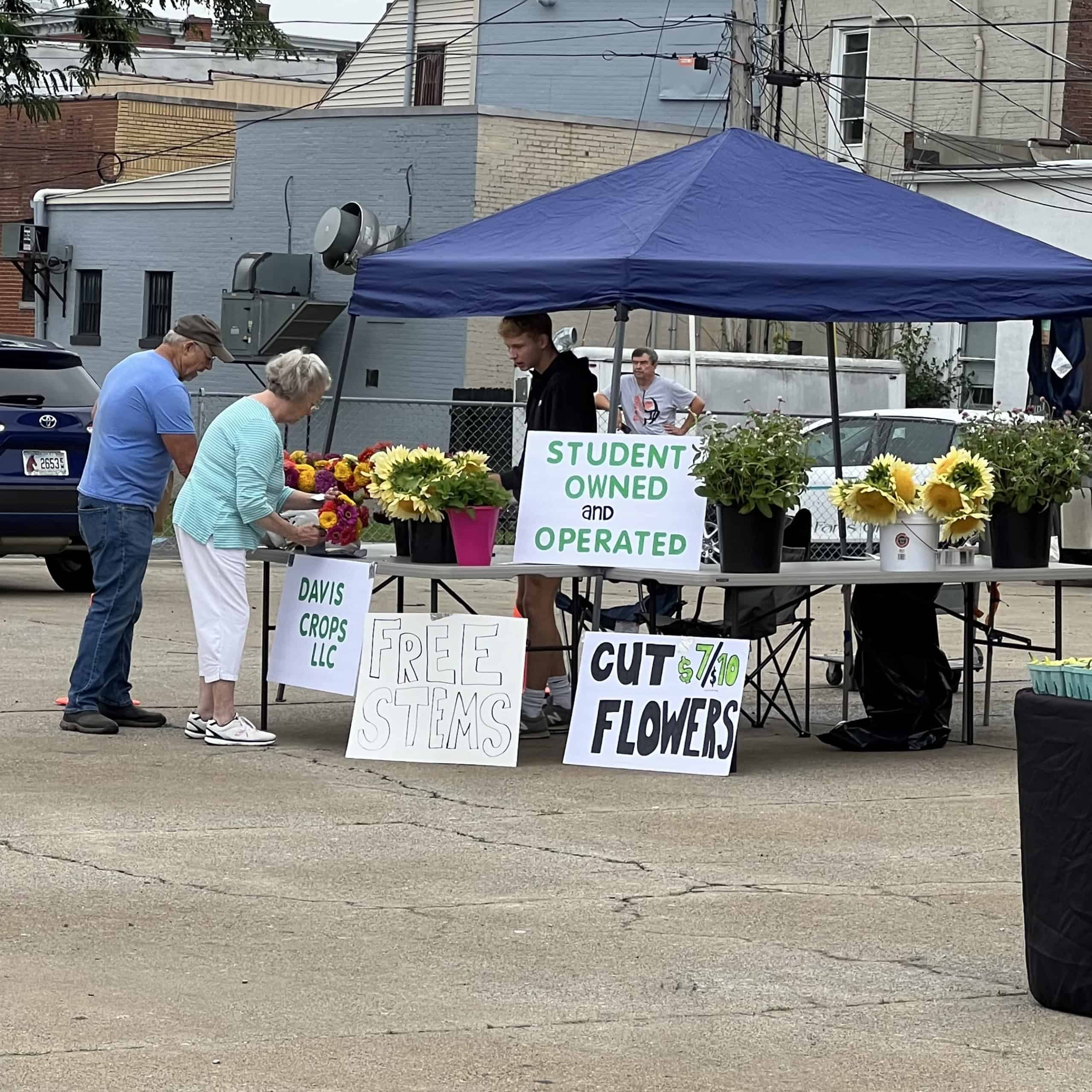Case Davis at a local farmers market selling his produce and flowers.