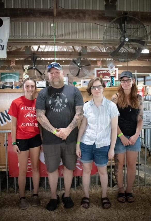 Domke poses with Josh Perry's family at the Endless Adventures program event.