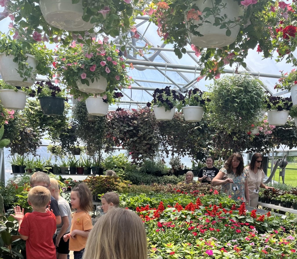 The North Clay FFA greenhouse being displayed to elementary students.
