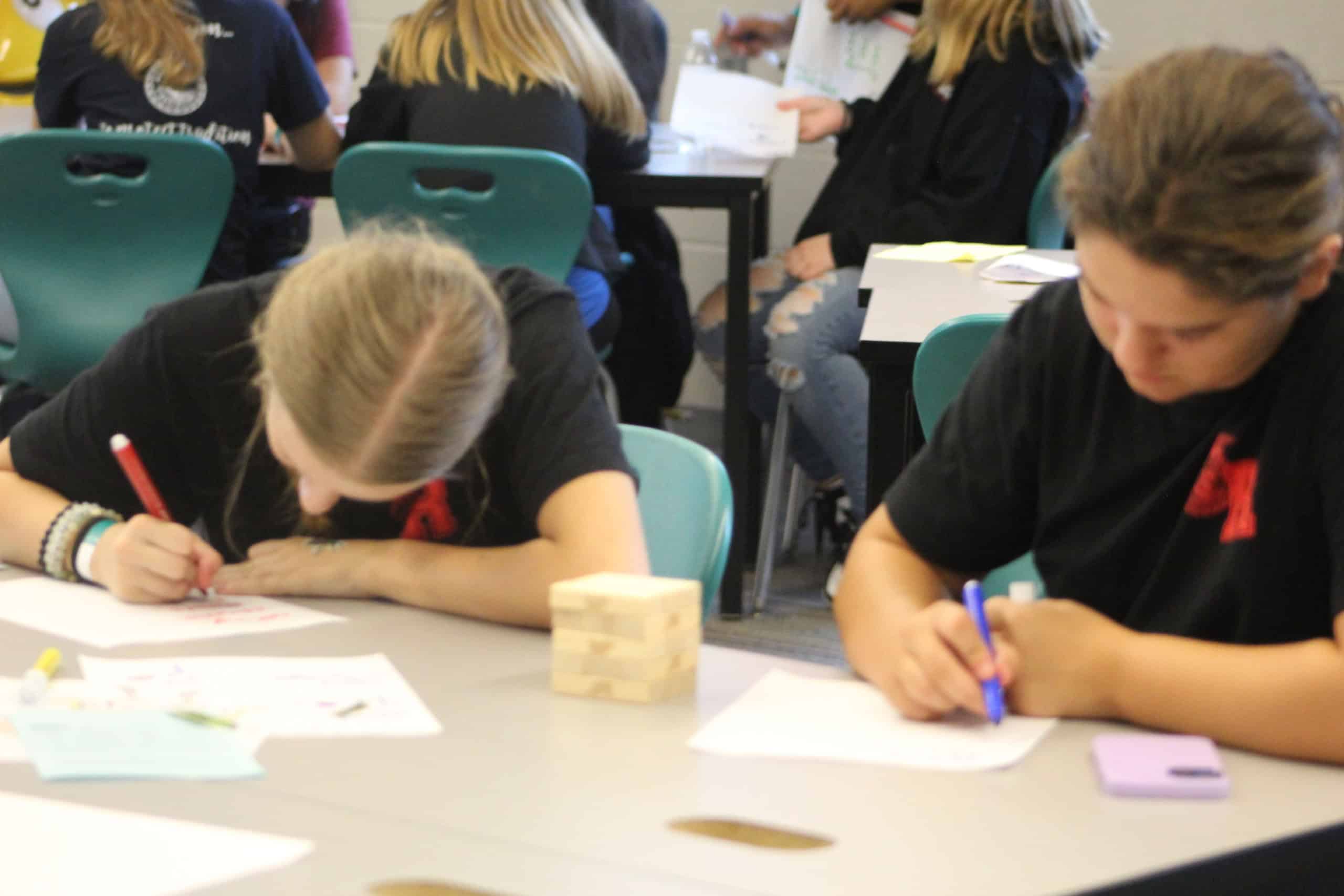 Students working diligently in a workshop.