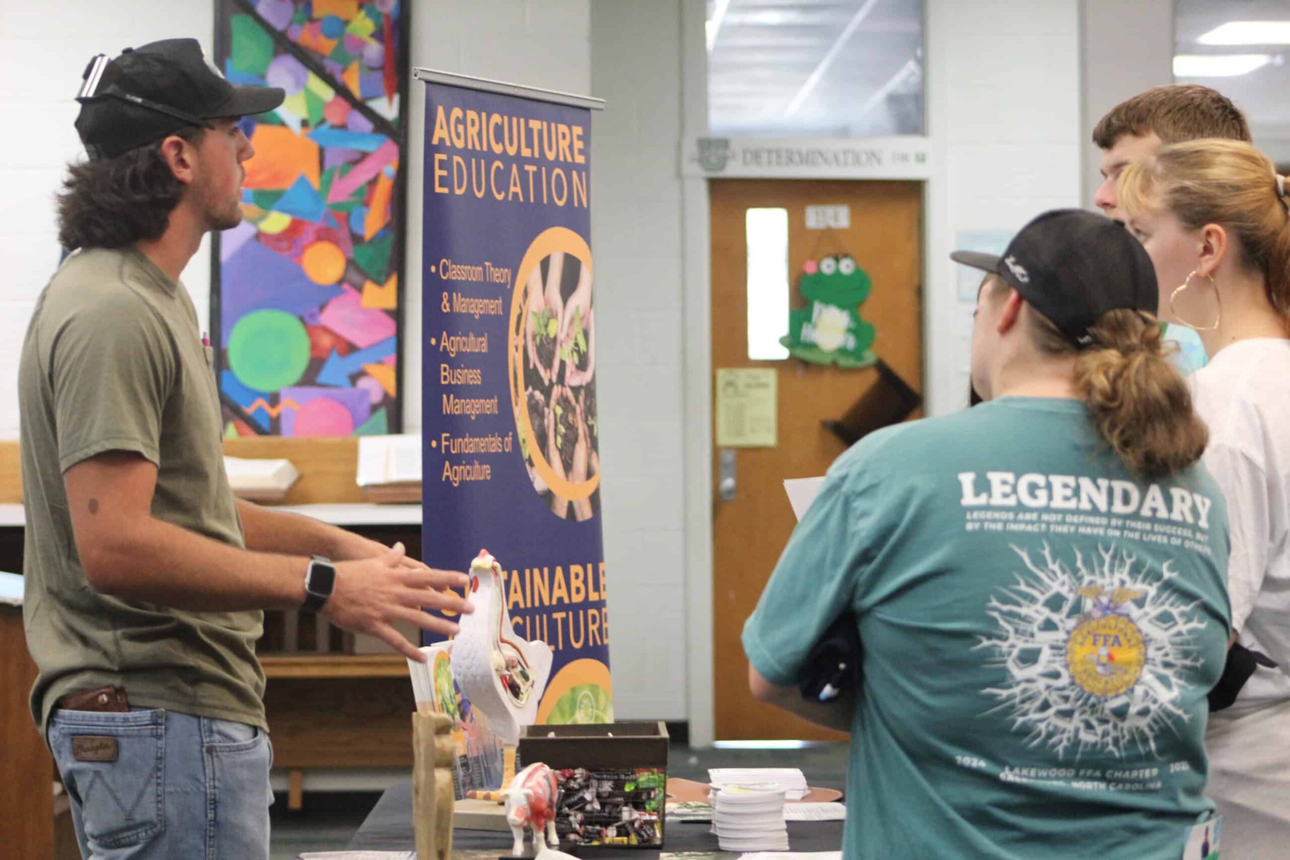 Students interacting with representatives at the college and career fair.