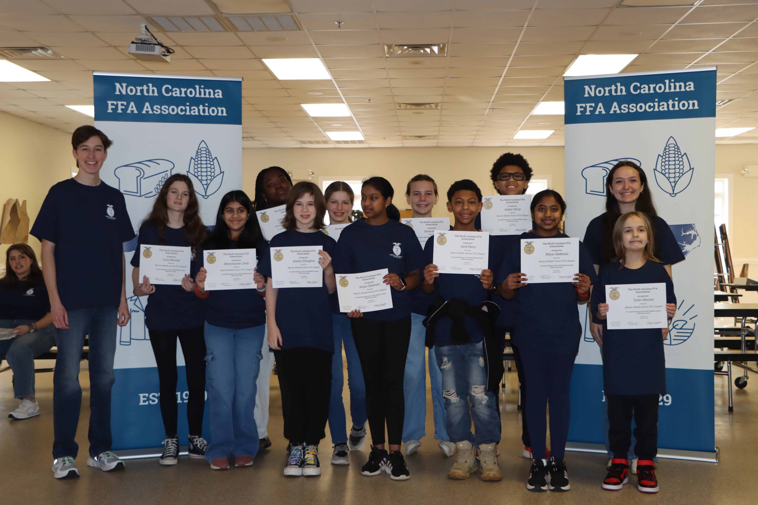 Members with their certificate of participation at the end of camp.