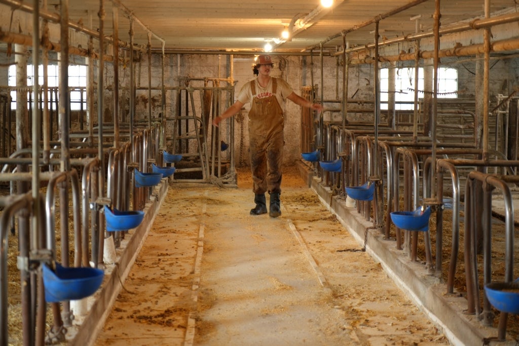 Cassellius shows off the Bartzes’ tile-style milking barn before bringing in cows for morning milking.