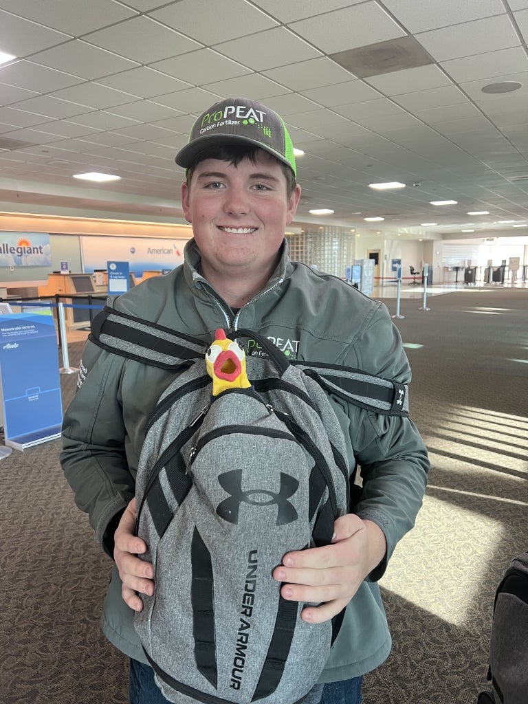 Sugar-Salem FFA member Brandon Little brings Patricia through the airport.