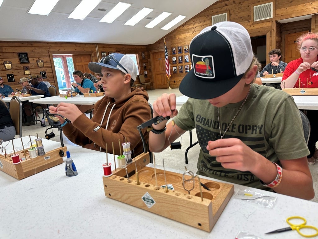 Members learn to make fishing flies at North Carolina FFA Wildlife Camp.