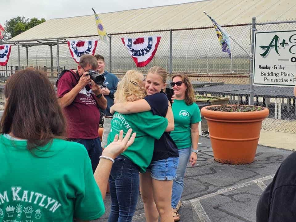 Tyler embraces her family and community supporters after her first attempt at breaking a record. Photo courtesy of Kaitlyn Tyler. 