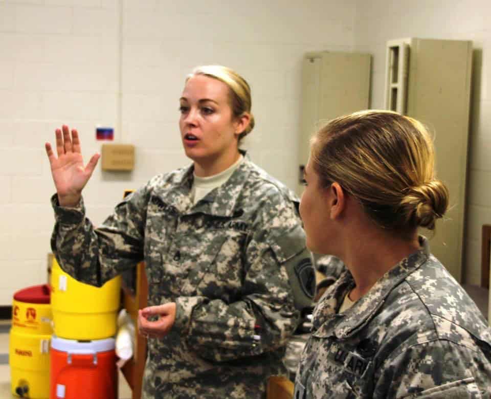 Knowles (left) talks to students during a class she taught as an Army instructor. Photo courtesy of Jackie Knowles.