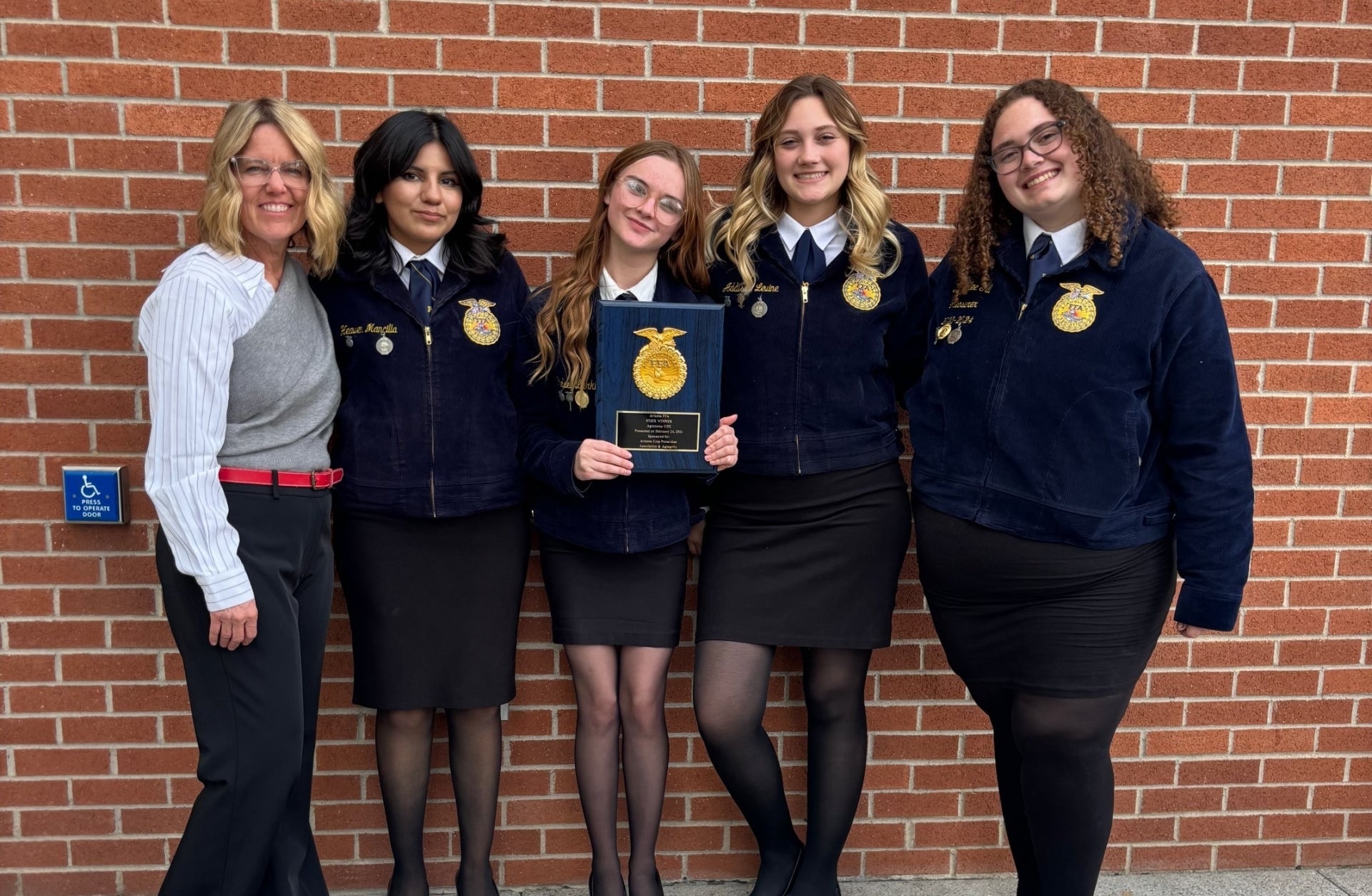 Chelsea Larkin (holding the plaque) and her state-winning Agronomy CDE team in 2024. 