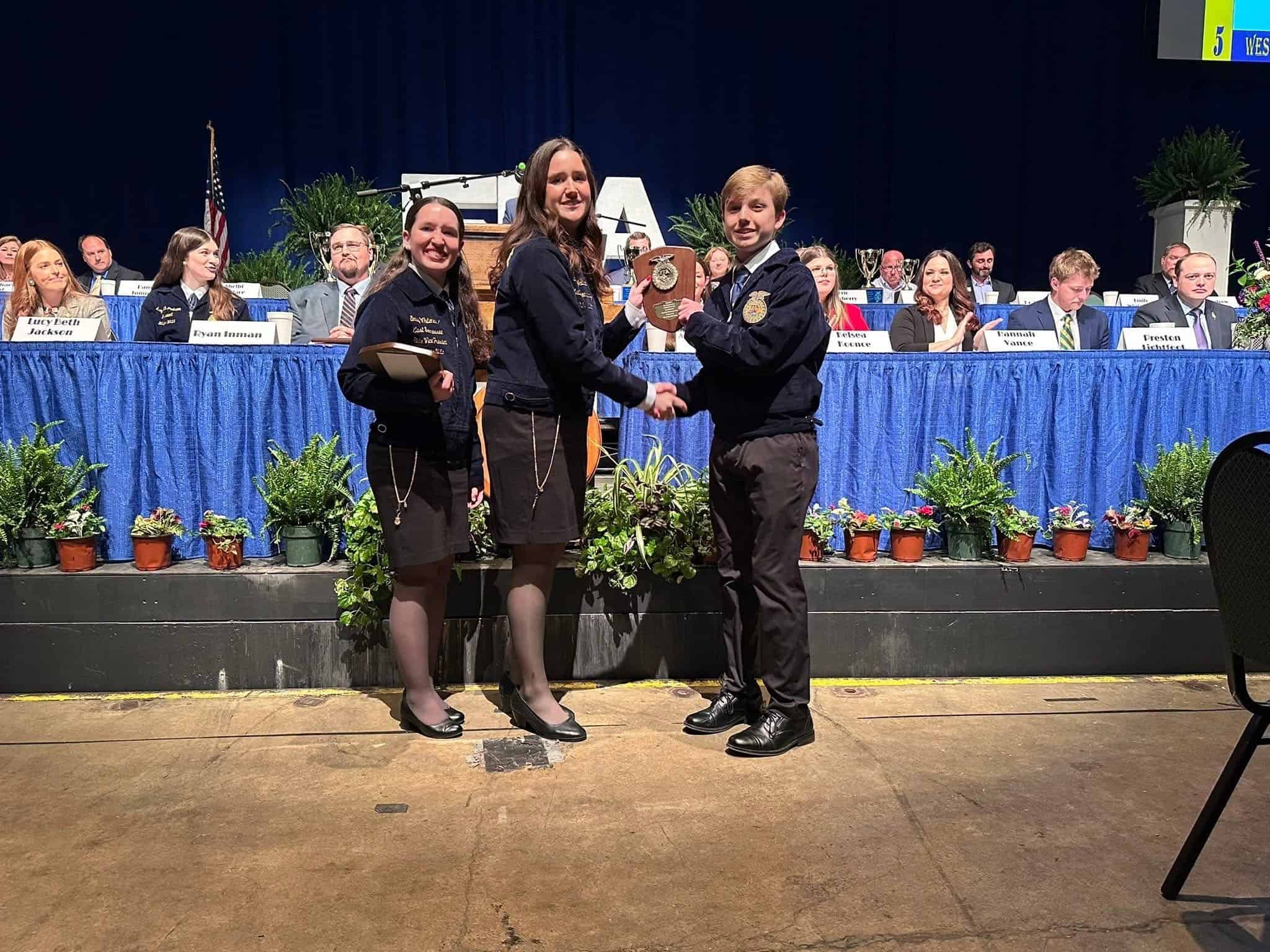Cooper Autry of the Scotts Hill FFA Chapter accepts his Creed Speaking award.