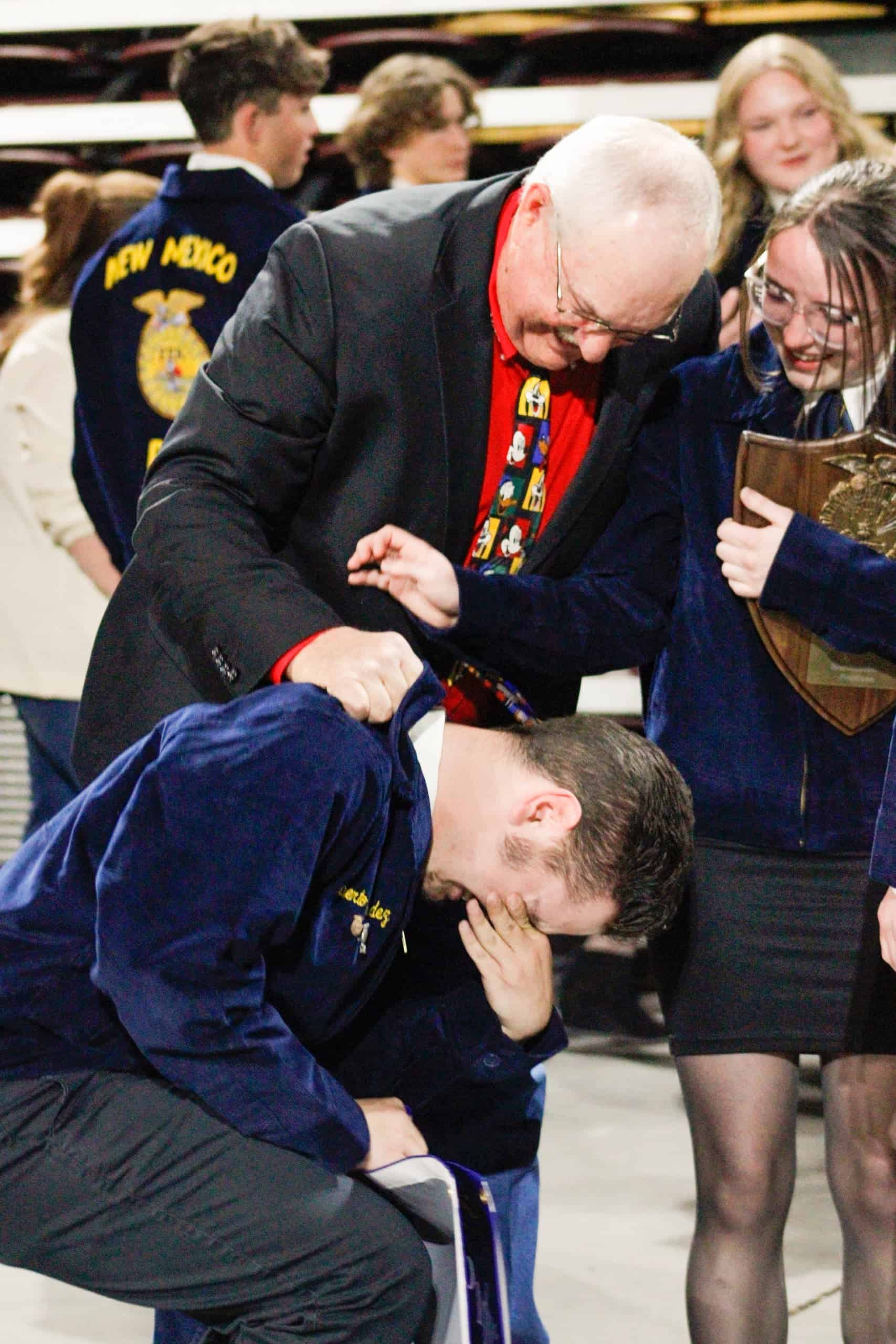 Mr. Johnson’s students are overjoyed after winning during his last year of teaching.