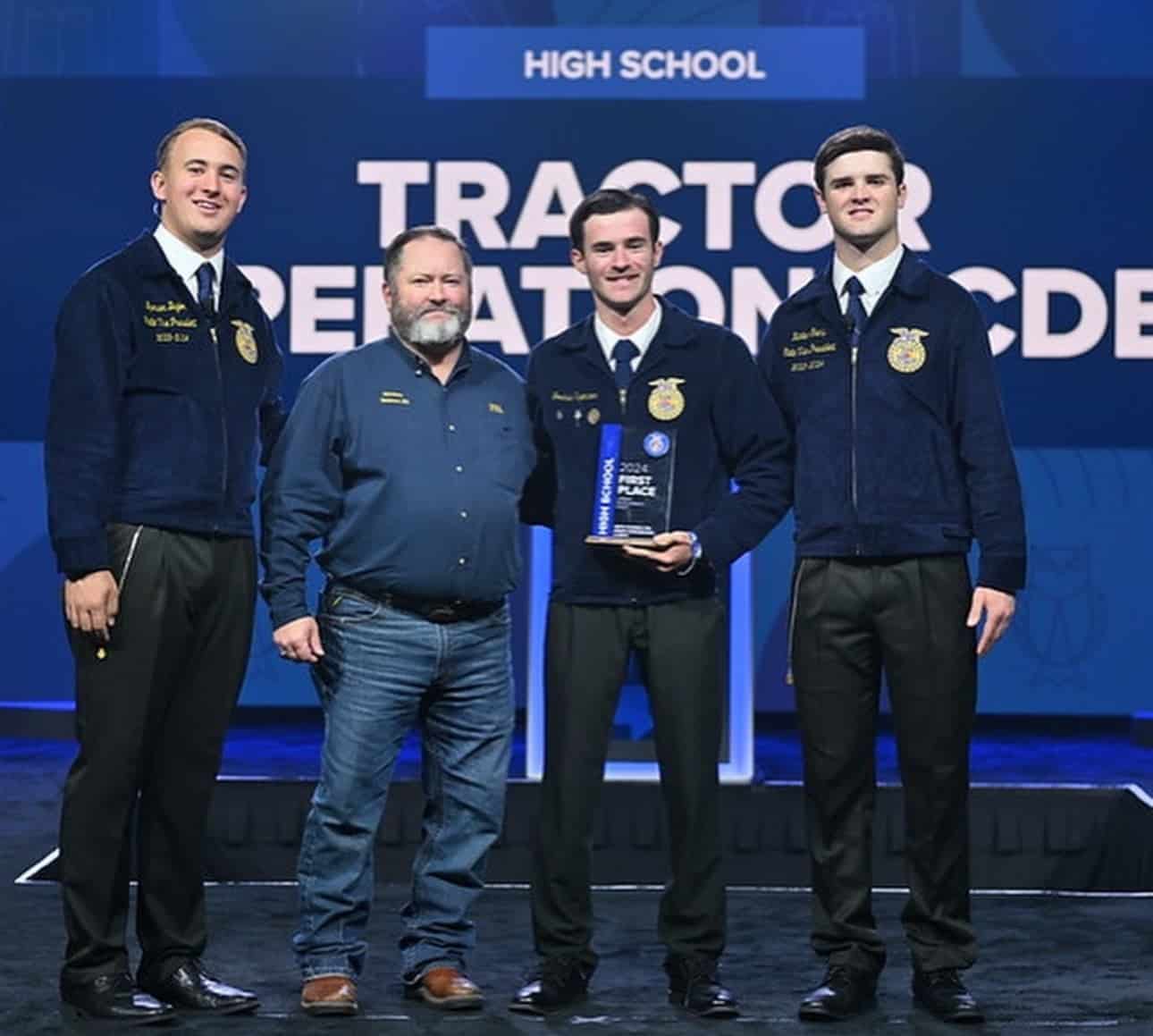 Spencer is presented with the State Champion CDE Award for Tractor Operations &amp; Mechanics.