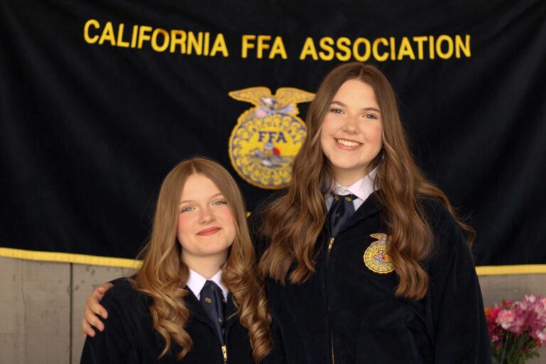 Reanna McLoughlin and Morgan Darrow pose for camera