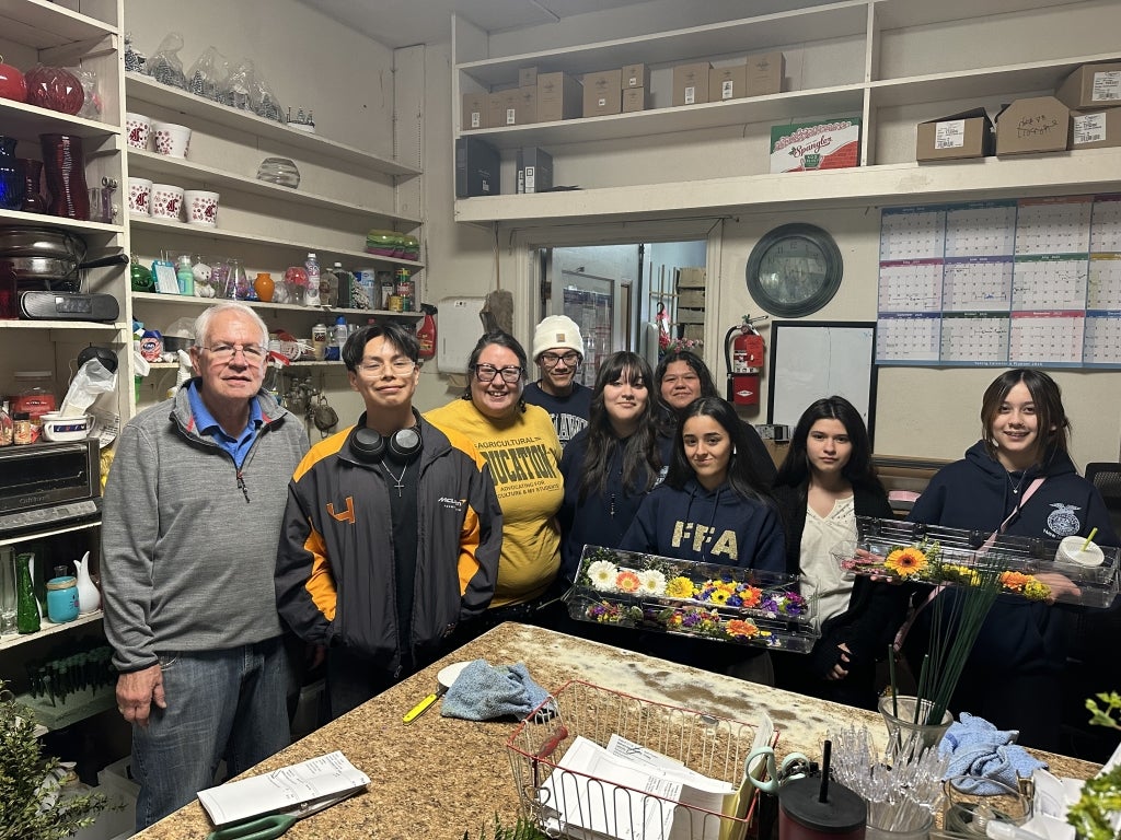 New Horizons FFA members participate in the “Teach Ag Olympics,” which included creating floral boutonnieres. Photo courtesy of Carol Travis. 