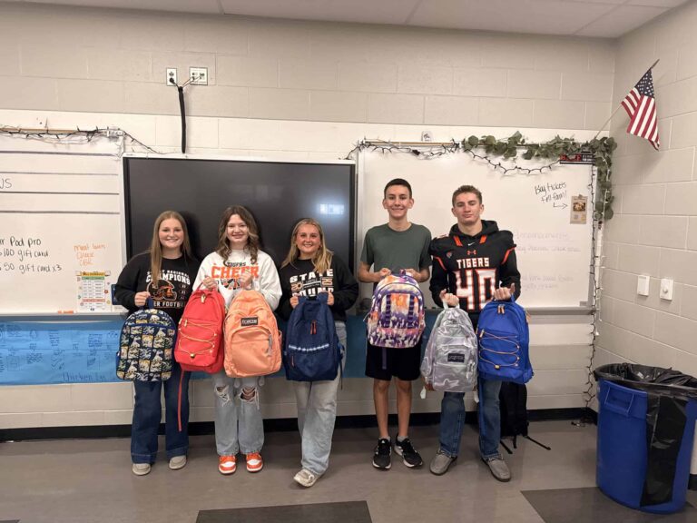The Liberty Center FFA Service Committee presents the first backpacks of the 2025-26 school year. Pictured, from left: Mackenzie Keller, Alyvia Meyer, Maddie Sattler, Cole Bauman, and Baxter Barrett.