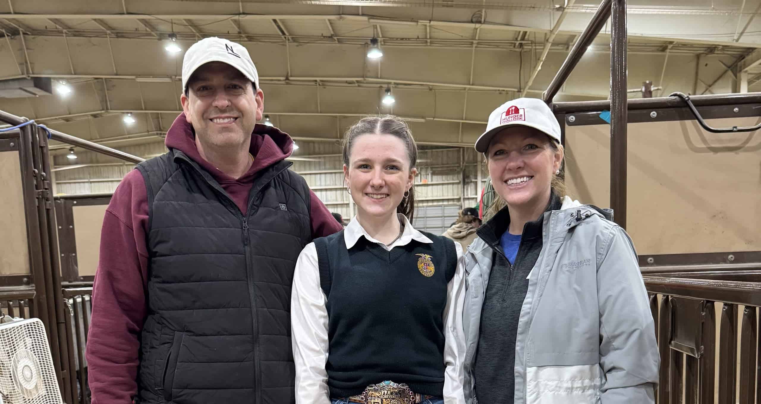 Maggie Carroll with her parents as they serve together. 