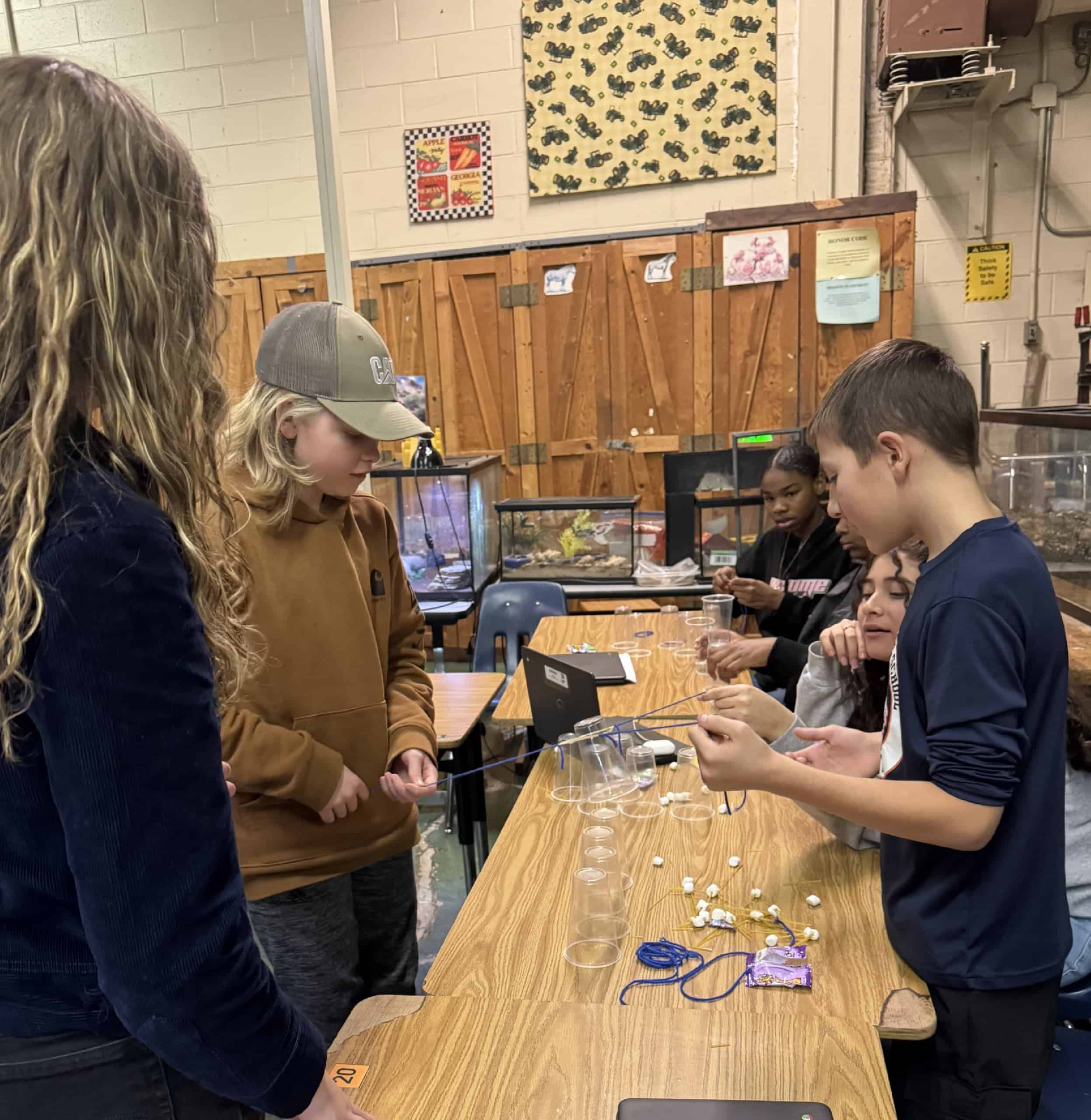 2024-25 Culpeper County FFA Vice President Madison Stephens guides Culpeper Middle School agriculture students through a modified version of the cup stack challenge, which required members to put their communication and leadership skills to the test.