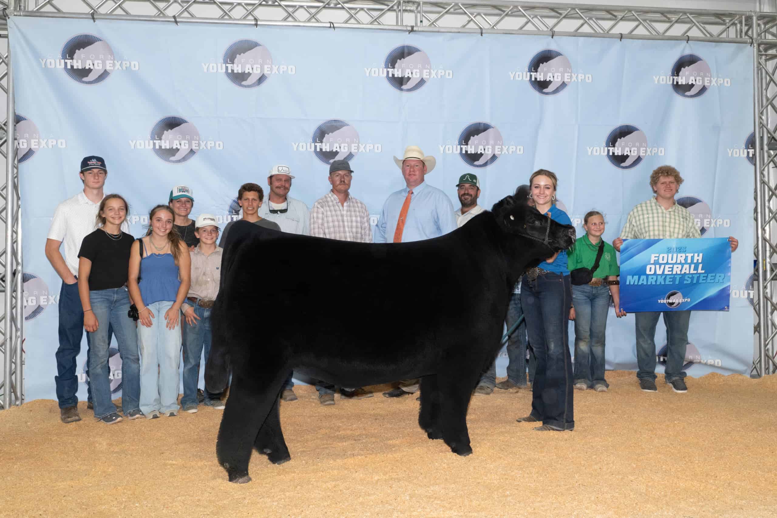 Allison, with her award from the California Youth Ag Expo, is pictured with her "team."