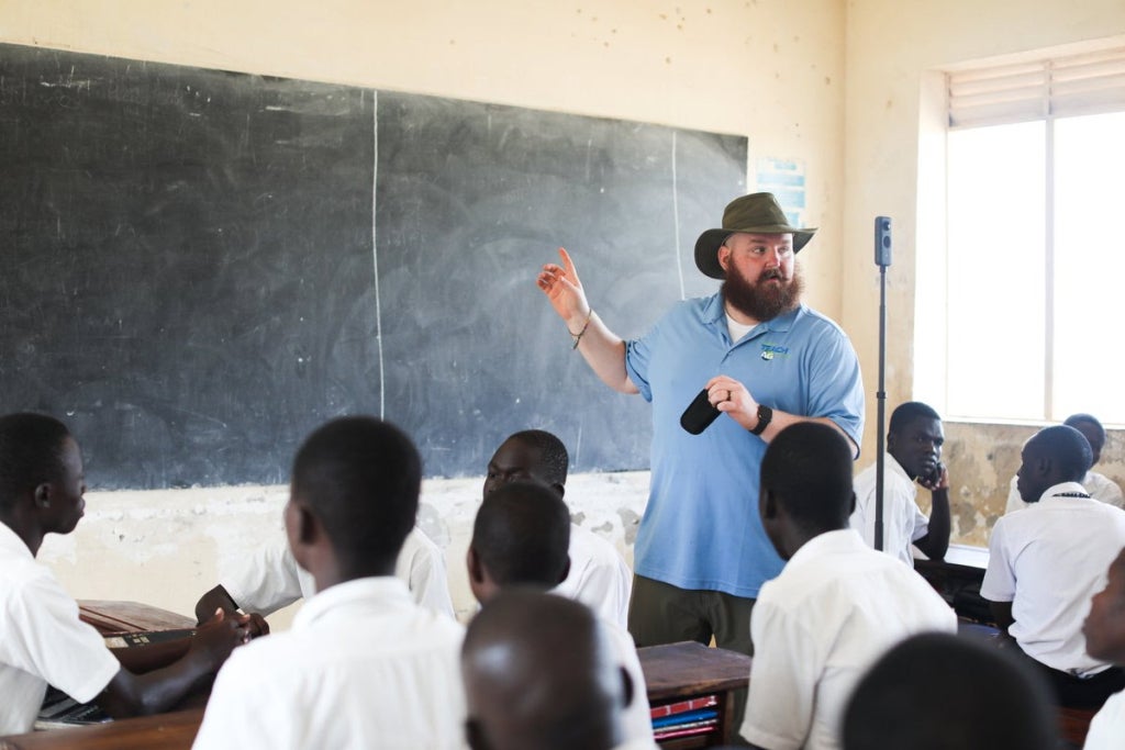 Dr. O.P. McCubbins teaching an agricultural education lesson in an international classroom.⁠