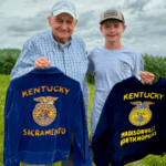 Cade King and his great grandfather Allen Whitmer holding their FFA Jackets