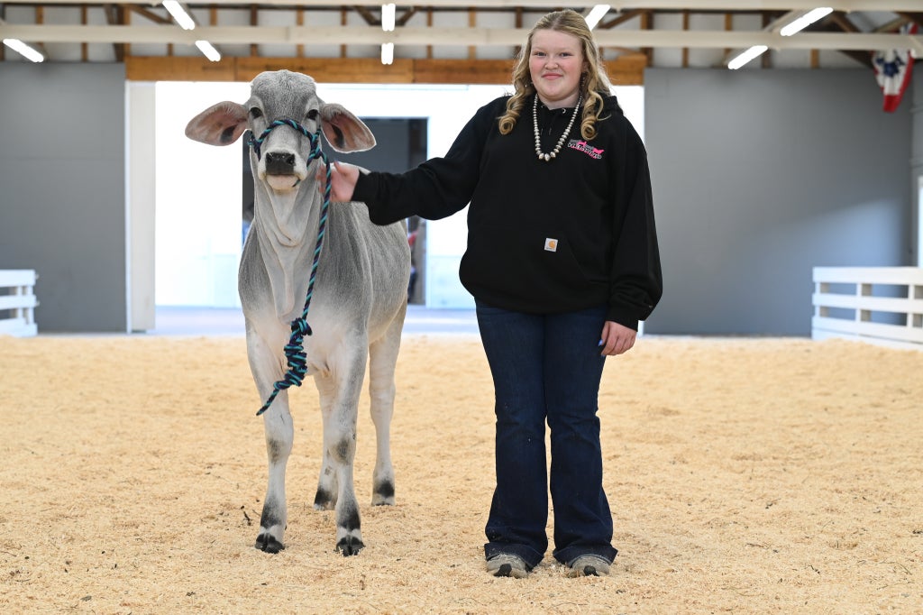 Hemond posing with her heifer, "Georgia."